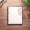 Minimalist workspace Top view of a notebook on wooden flooring