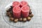 Minimalistic advent wreath with sweet chestnuts on glass plate