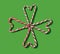 Minimalistic eight candy canes forming lucky Irish shamrock. Flat lay arrangements on authentic green background