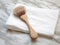 Minimalistic Elegance: Unraveling the Charm of a Brush and Towel on Pristine White Marble