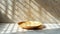 Minimalistic food photography on work desk with beige plate in cool toned daylight setting