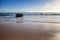 minimalistic marine background, blue ocean, sandy beach, footprints in the sand