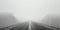 Minimalistic misty empty highway. Foggy road. Mystery travel concept. Generative AI