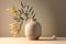 Minimalistic modern vase in neutral color with a branch of green leaves. Contemporary composition on beige background. Created