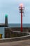 Minimalistic picture of entrance to the port with red and green navigation light