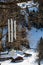 Minimalistic steel wind chime hung on tree in mountans