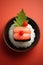 Minimalistic sushi and rice on black plate, red background, close-up,asian culinary concept,top view