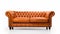 Minimalistic Symmetry: Orange Leather Chesterfield Sofa