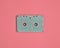 Minimalistic trend of audio technology from the 80s. Audio cassette on pastel color background