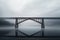 minimalistic view of a cantilever bridge on a cloudy day