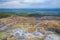 Mining from above. Industrial terraces on open pit  mineral mine. Aerial view of opencast mining. Dolomite Mine Excavation.