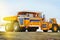 Mining dump truck at sunset on a concrete pavement.