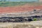 Mining dump trucks working in Lignite coalmine