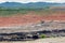 Mining dump trucks working in Lignite coalmine