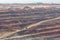 Mining dump trucks working in Lignite coalmine lampang thailand