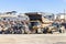 Mining trucks and machinery in Corta Atalaya open mine pit. Deep excavation of pyrite and extraction of minerals of cooper and