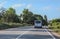 Minivan moves on a suburban highway