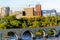 Minneapolis, MN, river and bridge with runner near downtown