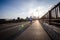 Minneapolis, MN - Woman jogger runs across the Stone Arch Bridge in downtown Minneapolis at dusk. Concept for active