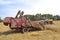 Minneapolis Moline tractor pulls a McCormick combine