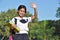 Minority School Girl Waving Holding Books