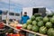 Minsk. Belarus. 09.03.2022 A man sells watermelons, melons, grapes and other fruits and vegetables at the fair.