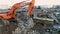 Minsk, Belarus 13.04.2020 - recycling of concrete, hydraulic excavator with jaw crusher at work, environmental