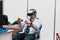 MINSK, BELARUS - April 18, 2017: Man trying play in Virtual Reality headset on TIBO-2017 the 24th International Specialized Forum