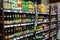 MINSK, BELARUS - August 24, 2019: Many bottles of beer of different brands show on a shelf for sale in a supermarket
