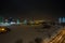 MINSK, BELARUS - DECEMBER 2018: lights of the night city. Light skyscraper reflected in the lake water