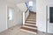 MINSK, BELARUS - JANUARY 2019: wooden spiral staircase in bright interior in vacation house