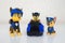 Minsk, Belarus - January 9, 2022: Paw patrol team. Miniatures of hero Chase with blue police truck