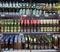 Minsk, Belarus, July 12, 2018: Many bottles of beer of different brands show on a shelf for sale in a supermarket