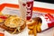 Minsk, Belarus, may 27, 2018: Burger, potatoes and paper cup with KFC logo on a tray in KFC Restaurant