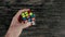 Minsk, Belarus - NOVEMBER 20, 2017: Boys hands solving Rubik`s Cube. Top view