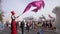 MINSK, BELARUS- SEPTEMBER 15, 2019: A man with a flag greets the participants of the half marathon. Festive atmosphere