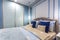 MINSK, BELARUS - SEPTEMBER, 2019: Interior of the modern luxure bedroom in studio apartments in blue light color style