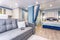 MINSK, BELARUS - SEPTEMBER, 2019: Interior of the modern luxure bedroom in studio apartments in blue light color style