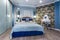 MINSK, BELARUS - SEPTEMBER, 2019: Interior of the modern luxure bedroom in studio apartments in blue light color style