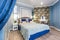 MINSK, BELARUS - SEPTEMBER, 2019: Interior of the modern luxure bedroom in studio apartments in blue light color style