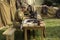 Minsk, city holiday on September 8, 2018. A male soldier sits at a table and types on a typewriter, next to war trophies.