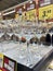 MINSK, MINSKAYA, MARCH 29, 2019, Rows of glass goblets on the shelf in the store. Black Friday sale