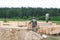 Minsk Region. Belarus. February 24, 2016. Workers drill holes for driving Nagel. construction of bony from natural wood