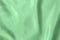 mint colored Background of soft draped fabric