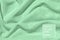 Mint colored draped fabric with silver lurex thread