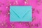 Mint envelope on pink background