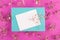 Mint envelope on pink background