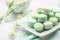 mint green macarons on white porcelain dish