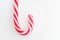 Mint hard candy cane striped in Christmas colours Red and White isolated on white background. Traditional Merry Christmas edible