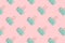 Mint paper clips pattern on a pink pastel background